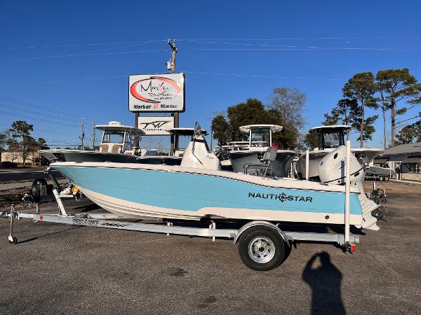 NauticStar 191 Hybrid 2025 NauticStar 191 Hybrid boat on trailer, displayed outdoors at a marina.