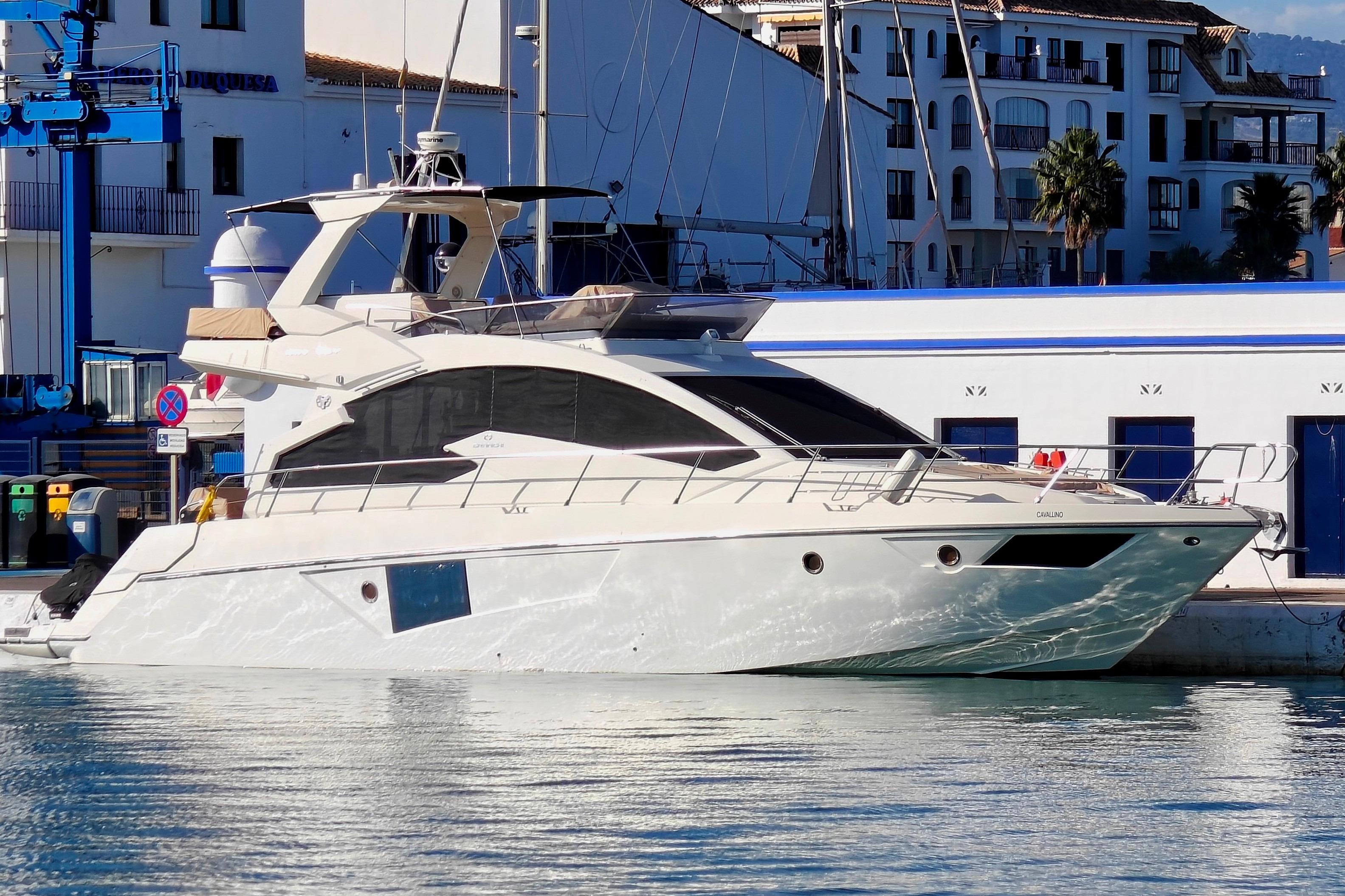 Cranchi Fifty 8 fly Luxury 2013 Cranchi Fifty 8 Fly yacht docked in a marina, with modern architecture backdrop.