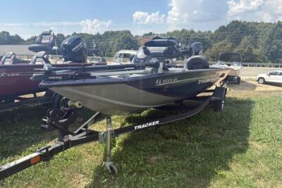 Tracker Pro Team 175 TF 2019 Tracker Pro Team 175 TF boat on trailer, parked on grass.
