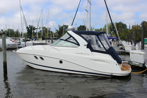 Rinker 310 Express Cruiser 2011 Rinker 310 Express Cruiser docked at a marina.