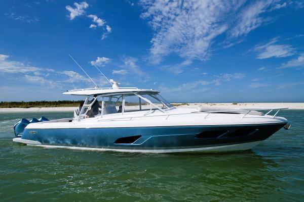 Intrepid 409 Valor 2021 Intrepid 409 Valor boat on water under clear blue sky.