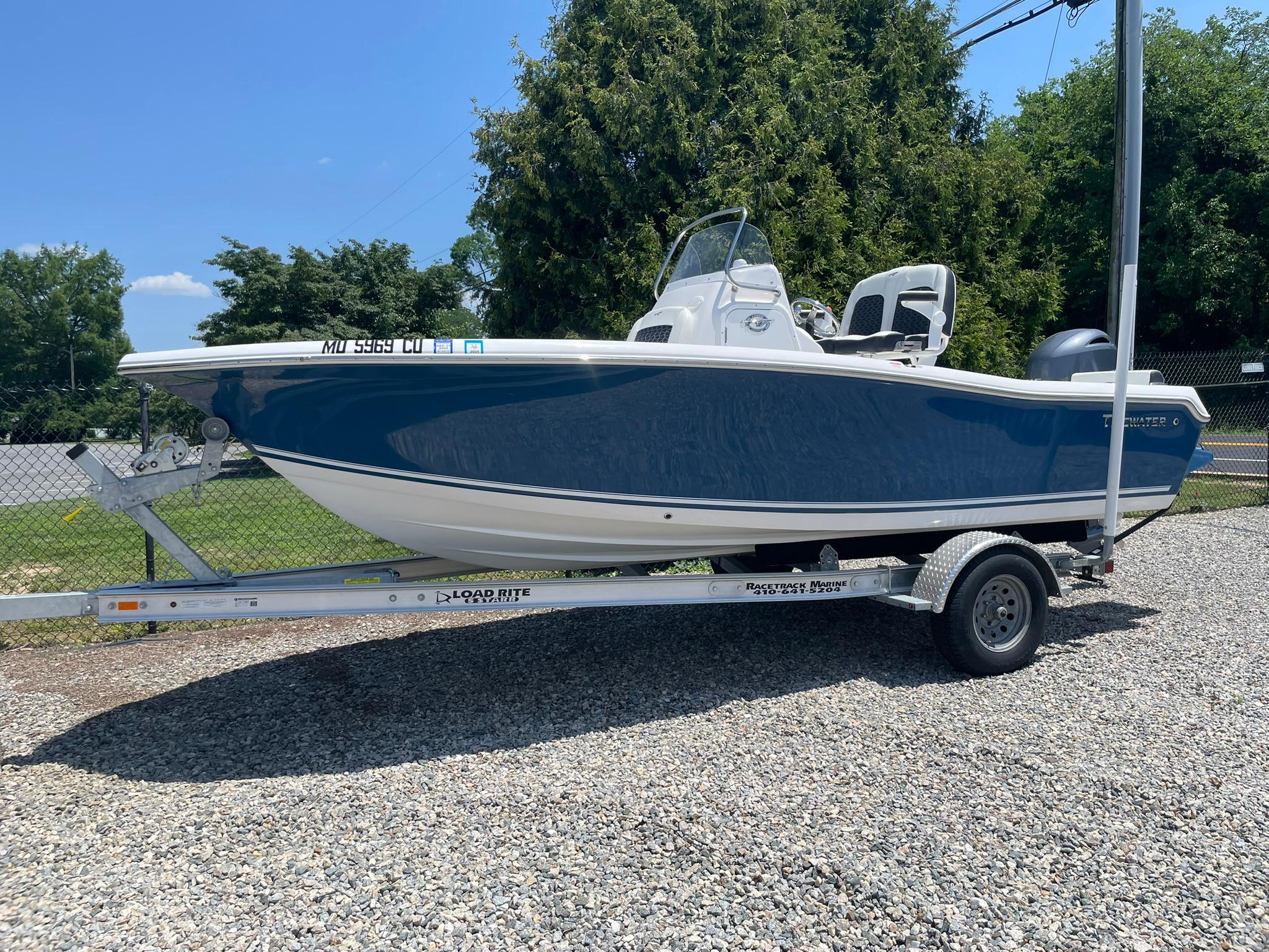 Tidewater 198 CC Adventure 2025 Tidewater 198 CC Adventure boat on trailer, parked outdoors.