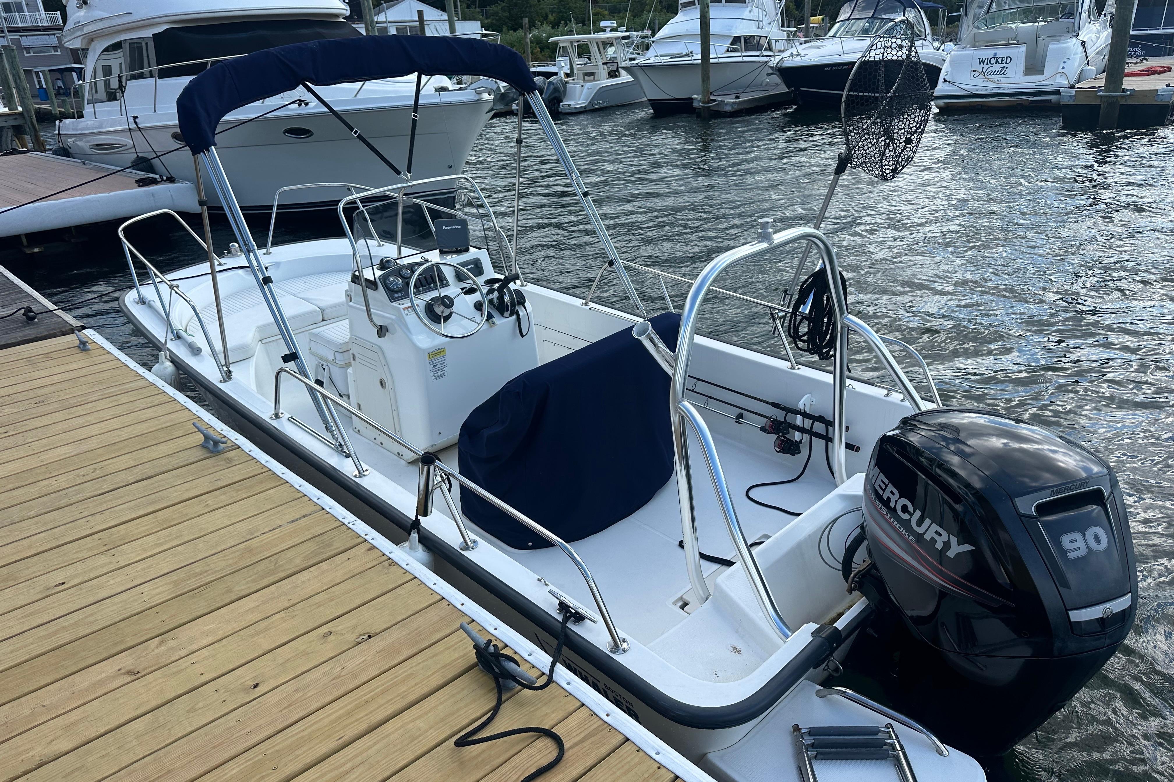 Boston Whaler 170 Montauk 2016 Boston Whaler 170 Montauk boat docked with Mercury 90 outboard engine.