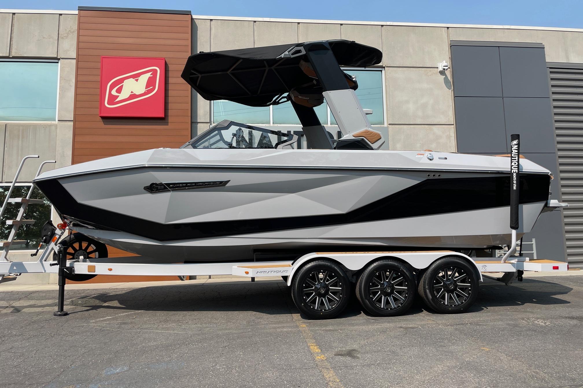 Nautique Super Air Nautique G23 2026 Nautique Super Air Nautique G23 boat on trailer, parked outside a building.