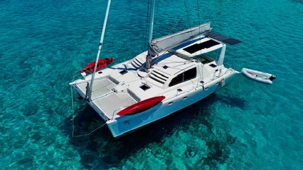 Leopard 45/47 Leopard 45/47 catamaran from 2000 on clear turquoise water, aerial view.