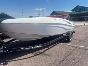 Tahoe T18 2024 Tahoe T18 boat on trailer in parking lot, sunny day.