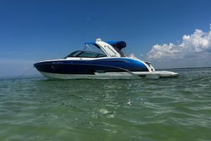 Formula 350 Crossover Bowrider OB 2017 Formula 350 Crossover Bowrider OB on calm water under clear blue sky.