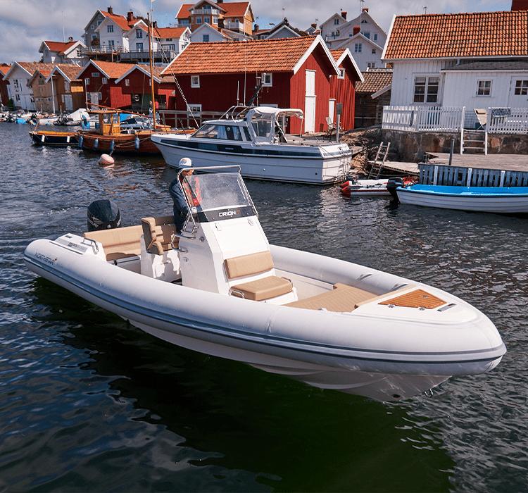 Northstar Orion 7 2022 Northstar Orion 7 boat docked near charming coastal village houses.