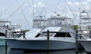 Viking 38 Convertible 1994 Viking 38 Convertible yacht docked at marina with fishing rods.