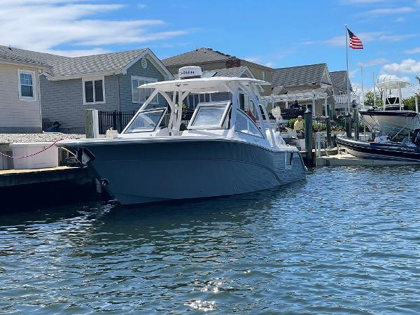 Sea Fox 288 Traveler 2024 Sea Fox 288 Traveler docked near waterfront homes.