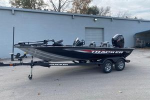 Tracker Pro Team 195 2026 Tracker Pro Team 195 boat on trailer, parked outdoors.