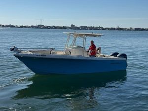 Sailfish 242 CC 2022 Sailfish 242 CC boat on calm water with a person onboard.