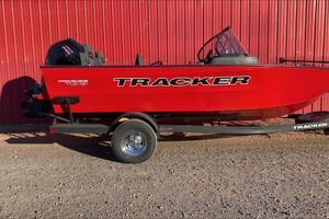 Tracker Pro Guide V-175 Combo 2026 Tracker Pro Guide V-175 Combo boat in vibrant red against a red wall.