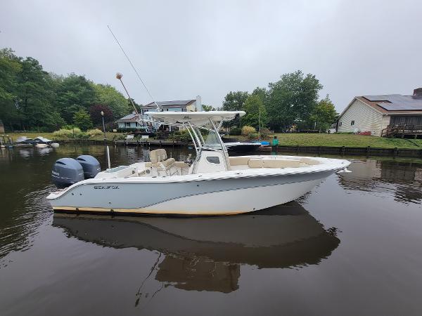 Sea Fox 266 Commander 2016 Sea Fox 266 Commander boat docked on a calm lake.