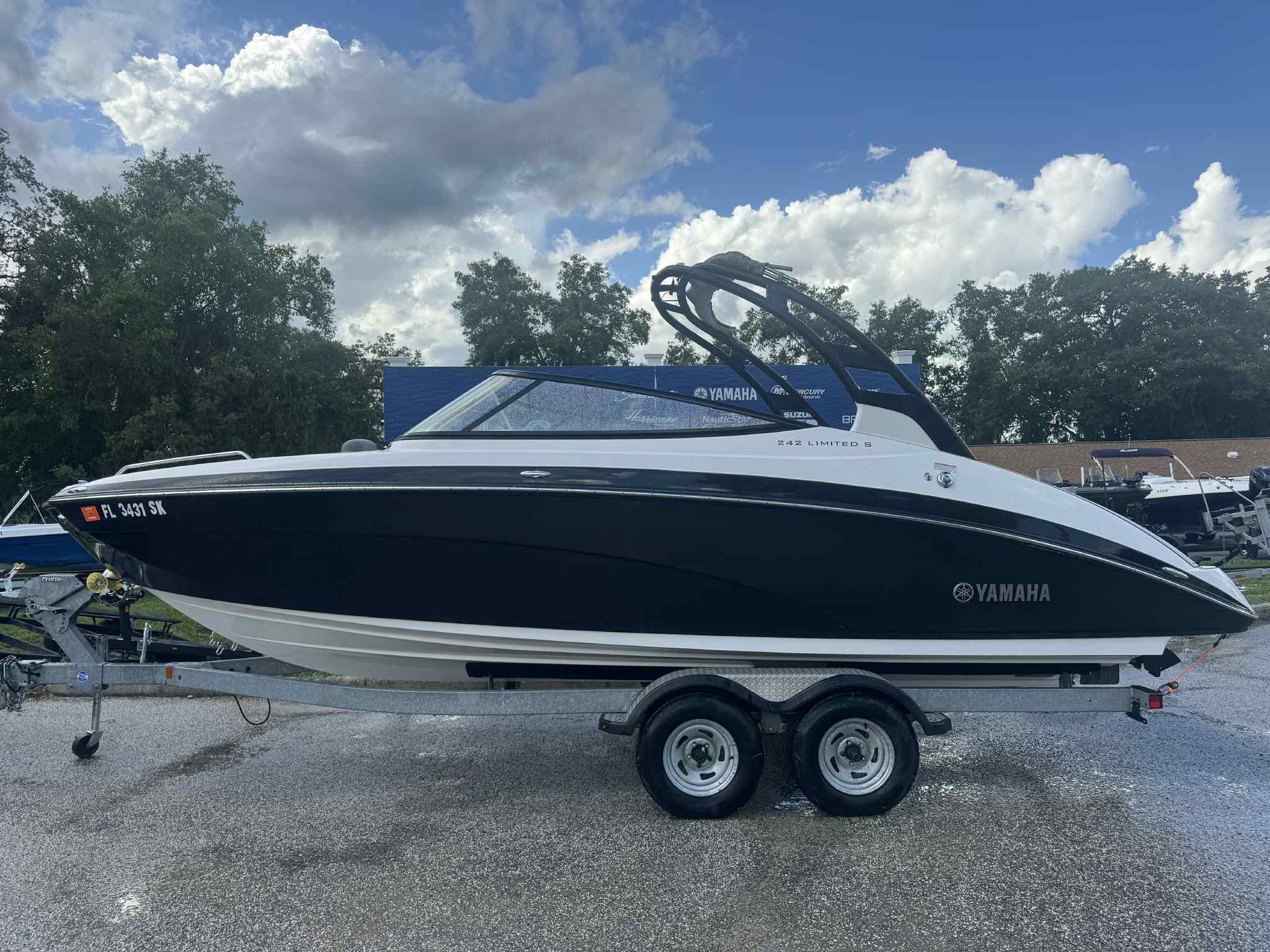 Yamaha Boats 242 Limited S 2017 Yamaha Boats 242 Limited S on trailer under cloudy sky.