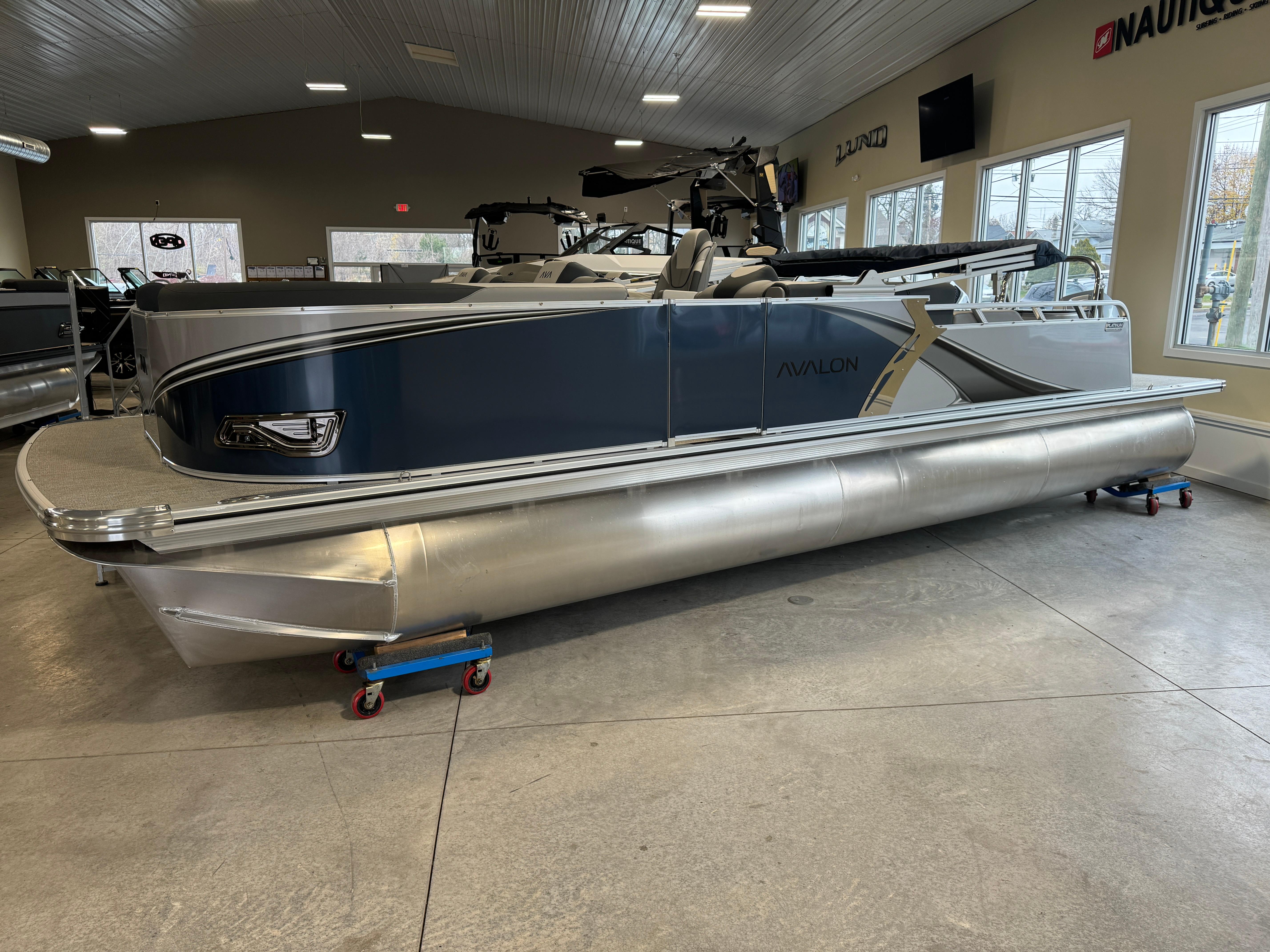 Avalon LSZ VRB 2025 Avalon LSZ VRB pontoon boat displayed indoors, showcasing sleek design and modern features.