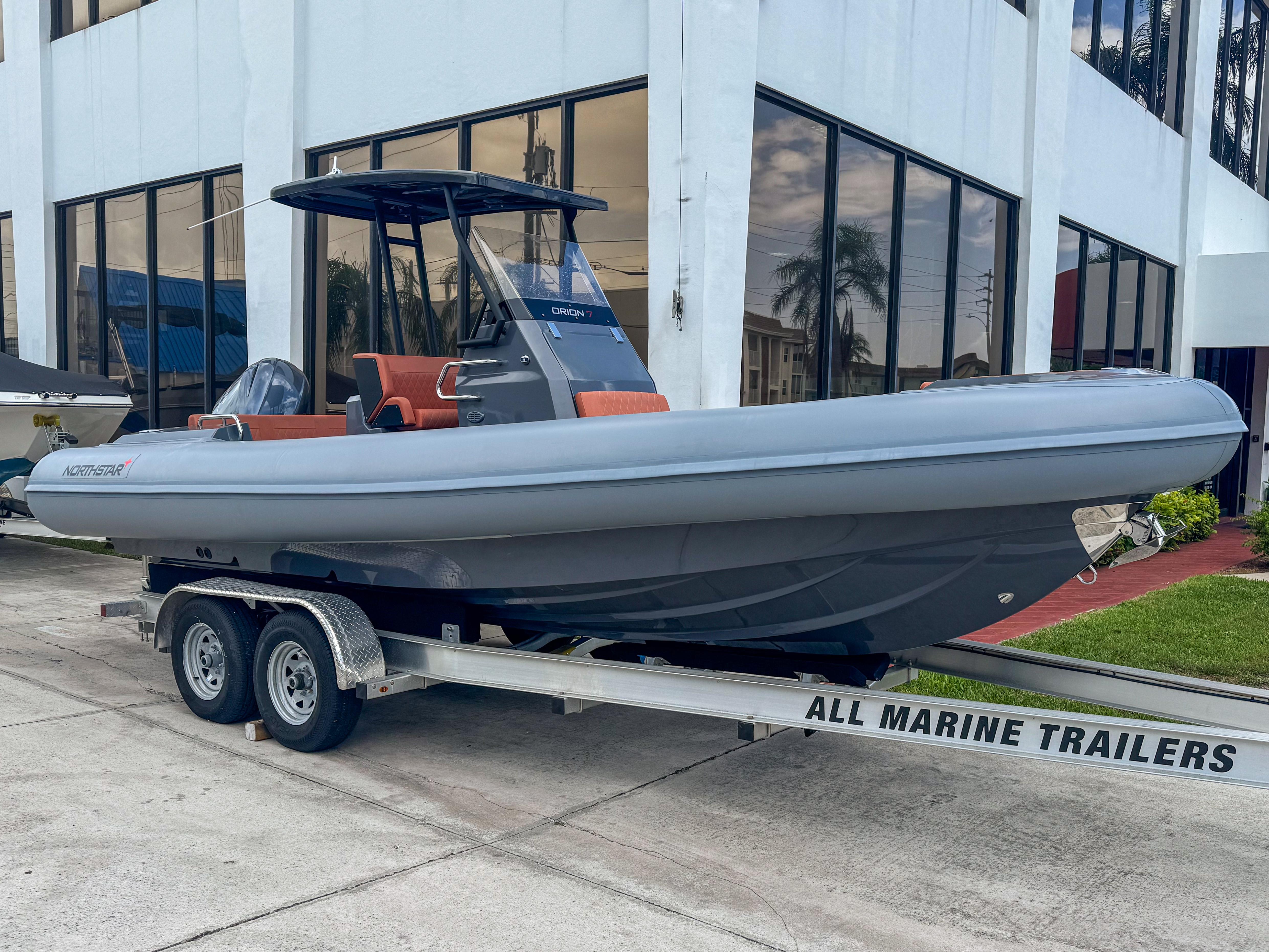 Northstar Orion 7 2023 Northstar Orion 7 boat on trailer outside a modern building.