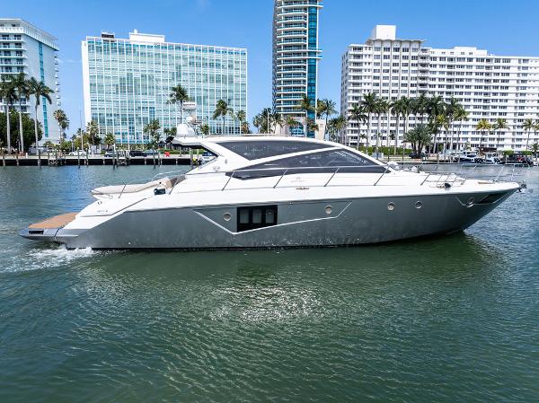 Cranchi 56 HT 2014 Cranchi 56 HT yacht cruising in urban waterfront setting.