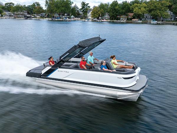 Manitou 22 Explore MAX Deck Navigator With 150hp Rotax Stealth Motor 2025 Manitou 22 Explore MAX Deck Navigator cruising on a lake with passengers.