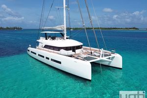 Lagoon Seventy 7 2023 Lagoon Seventy 7 catamaran sailing in clear turquoise waters.