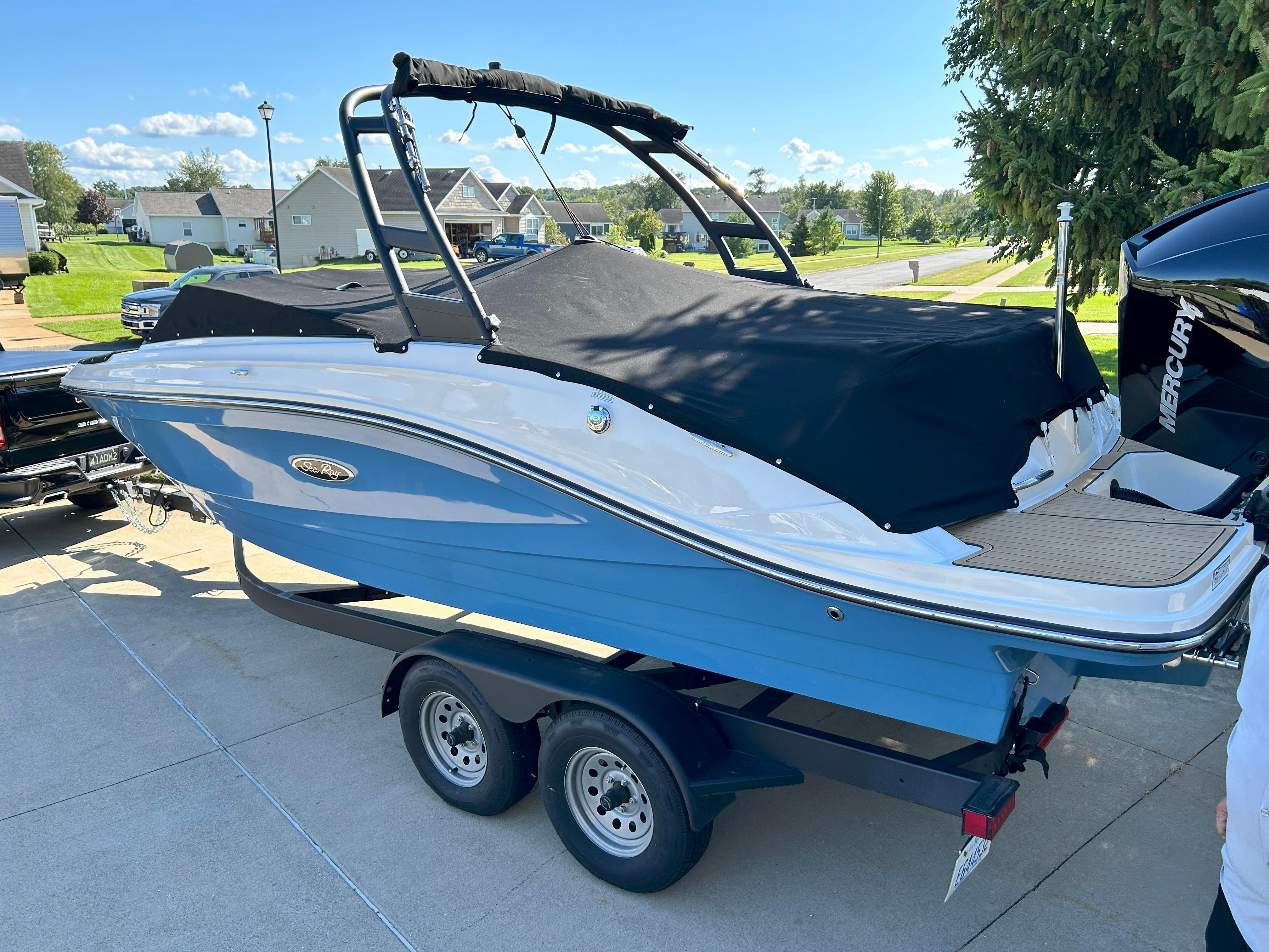 Sea Ray SPX 230 Outboard 2022 Sea Ray SPX 230 Outboard boat on trailer, covered, in residential driveway.