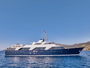 Picchiotti Custom 40 Picchiotti Custom 40 yacht, 1981 model, cruising on clear blue waters with scenic background.
