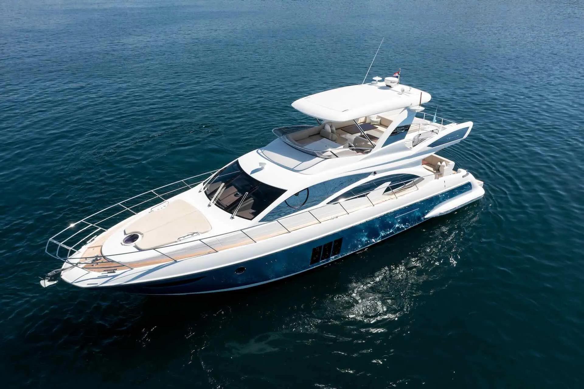Azimut Fly 60 Luxurious 2015 Azimut Fly 60 yacht cruising on calm blue waters.