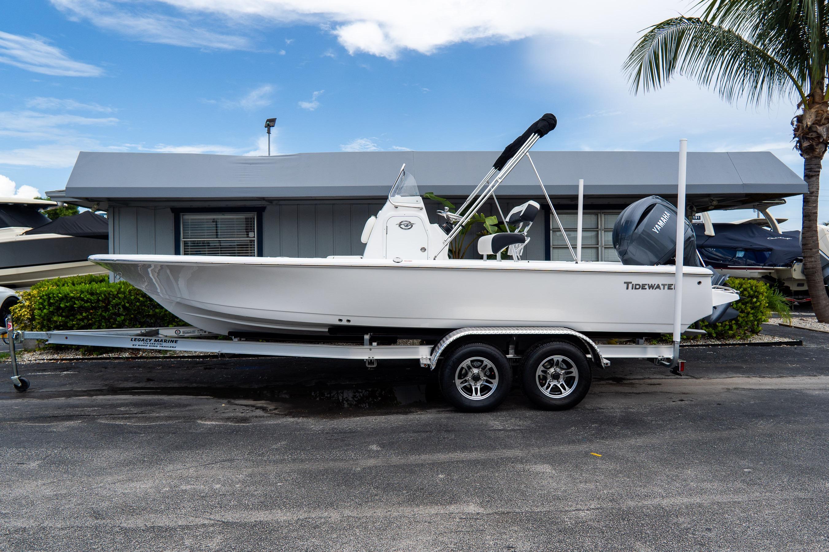 Tidewater 2110 Bay Max 2026 Tidewater 2110 Bay Max boat on trailer, parked near a building with palm trees.