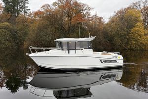 Jeanneau Merry Fisher 755 Marlin 2016 Jeanneau Merry Fisher 755 Marlin boat on calm water, surrounded by autumn trees.