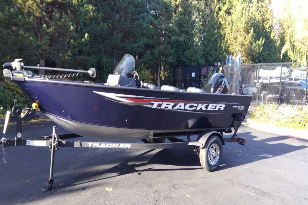 Tracker Pro Guide V-16 SC 2026 Tracker Pro Guide V-16 SC boat on trailer, parked outdoors.