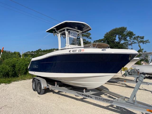 Robalo R222 Center Console 2016 Robalo 2220 Center Console boat on trailer, parked outdoors.