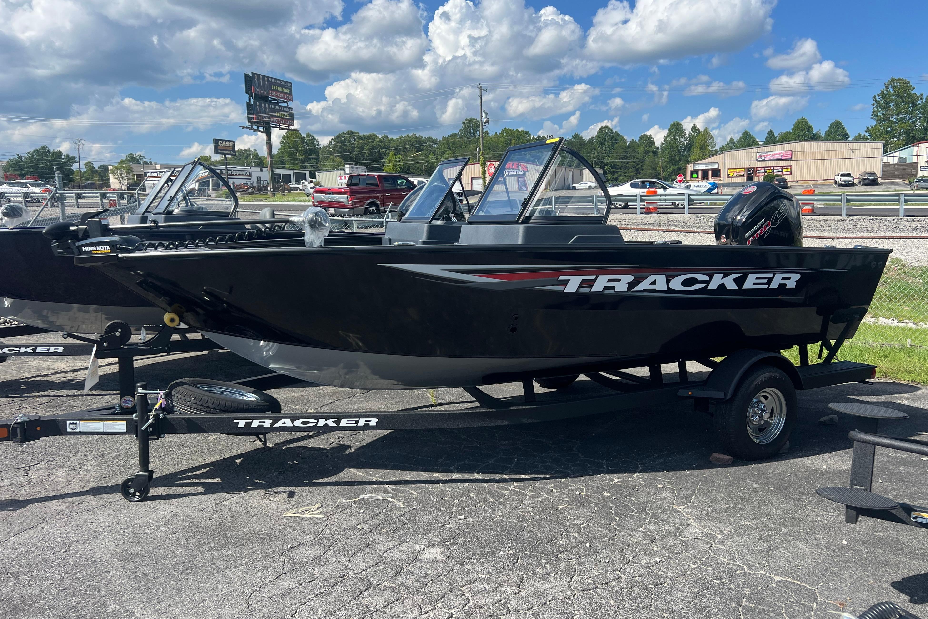 Tracker Pro Guide V-175 WT 2026 Tracker Pro Guide V-175 WT boat on trailer, parked outdoors under a cloudy sky.