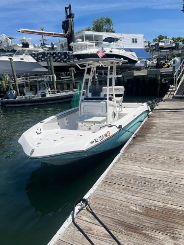 Yamaha Boats 190 FSH 2020 Yamaha Boats 190 FSH docked at marina, clear sky background.
