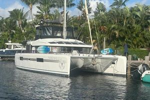Lagoon 52 F 2017 Lagoon 52 F catamaran docked by tropical palm trees.