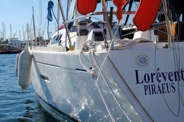 Dufour 405 Sailing yacht Dufour 405, 2010 model, docked at marina with visible ropes and fenders.