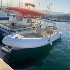 Scanner Dillennium White boat docked in marina, sunny day, calm water, surrounded by other vessels.