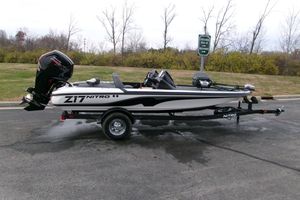 Nitro Z17 2026 Nitro Z17 boat on trailer, parked outdoors, showcasing sleek design and powerful engine.
