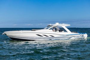 Deep Impact 499 Sport 2025 Deep Impact 499 Sport boat cruising on open water under clear blue sky.