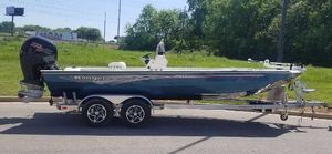 Ranger RB210 2024 Ranger RB210 boat on a trailer, parked outdoors.