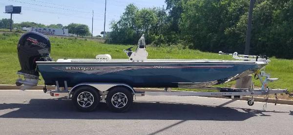 Ranger RB210 2024 Ranger RB210 boat on a trailer, parked outdoors.