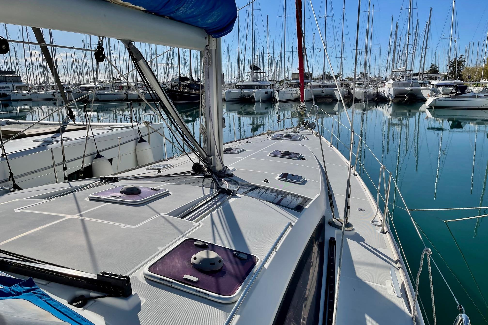 Jeanneau 53 2011 Jeanneau 53 sailboat docked in a marina, surrounded by other boats.