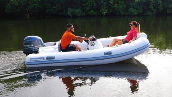 Northstar Axis 3.8 2024 Northstar Axis 3.8 inflatable boat on a calm river.