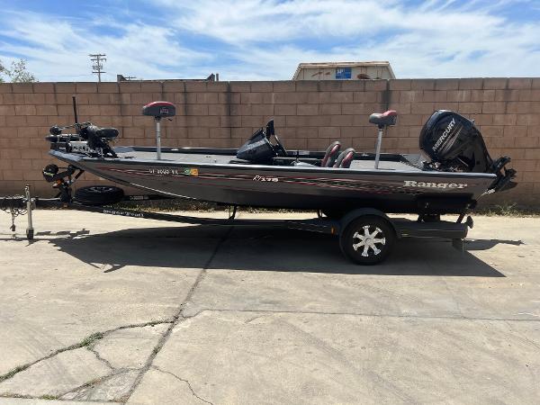 Ranger RT178 2019 Ranger RT178 fishing boat on trailer, parked outdoors.