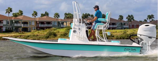 Shallow Sport 22 Sport 2025 Shallow Sport 22 Sport boat cruising on water with scenic background.