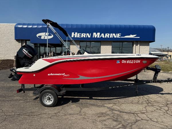 Bayliner Element M15 2022 Bayliner Element M15 boat in red, parked at Hern Marine dealership.