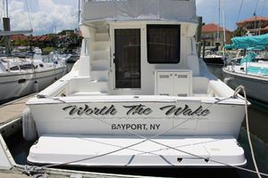 Silverton 42 Convertible 2006 Silverton 42 Convertible yacht docked, named "Worth The Wake," in Bayport, NY marina.