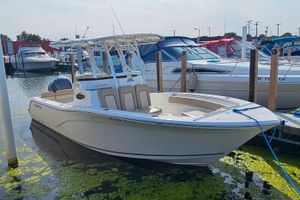 Sea Fox 249 Avenger 2018 Sea Fox 249 Avenger boat docked in a marina, surrounded by other vessels.