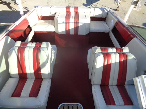 Sea Ray Seville 20 Bow Rider 1988 Sea Ray Seville 20 Bow Rider interior with red and white striped seats.