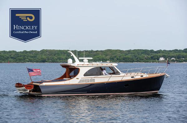 Hinckley Talaria 43 2014 Hinckley Talaria 43 yacht on water, American flag, certified pre-owned.