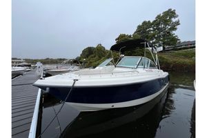 Hydra-Sports Lightning 202 DC 2006 Hydra-Sports Lightning 202 DC boat docked on calm water, overcast sky.